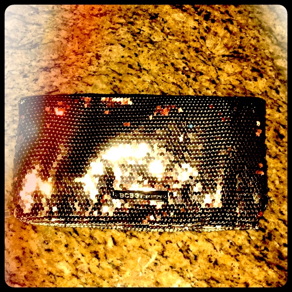 BCBG Generation fold over sequin clutch